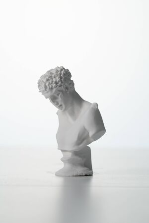 Hermes plaster figure in white background