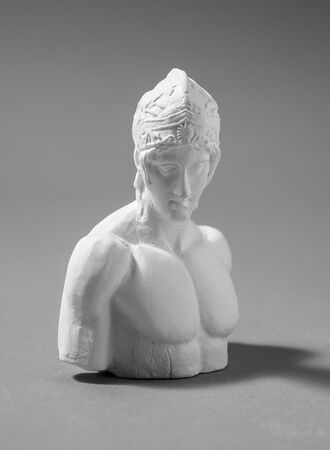 a plaster figure with a gray backgroundの写真素材