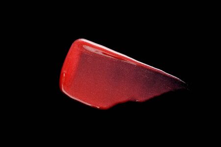 Texture of Red Lipgloss Liquid, Black Background.の写真素材