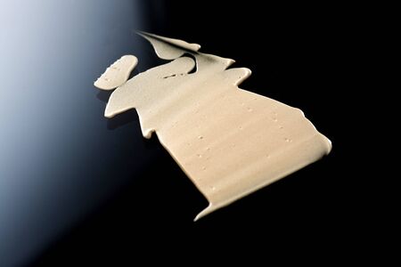 the texture of a foundation liquid. Black background.の写真素材