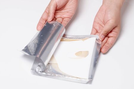 open mask sheet pouch. tear with one's hand.の写真素材