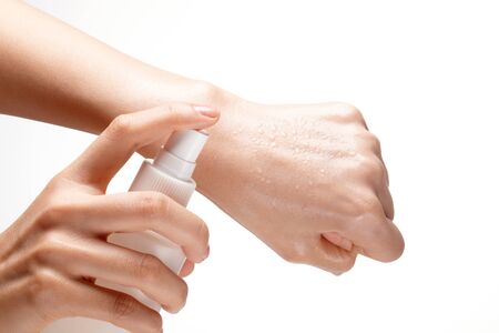 spray cosmetics on the back of one's hand. pump liquid.の写真素材