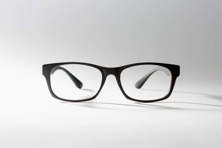 black rimmed glasses. the shadow of one's glasses.の写真素材