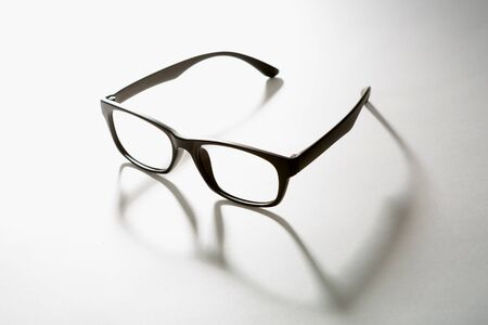 black rimmed glasses. the shadow of one's glasses.の写真素材