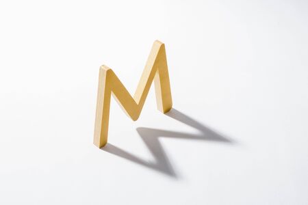 Wooden Alphabet M and Shadow Reflection.の写真素材