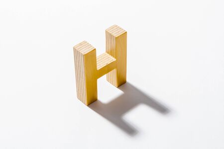 Wooden Alphabet H and Shadow Reflection.の写真素材