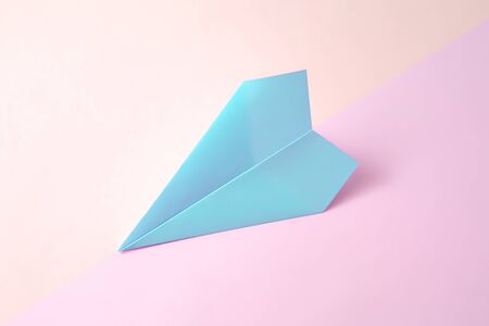 paper airplane on pastel background.の写真素材
