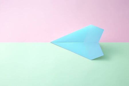 paper airplane on pastel background.の写真素材