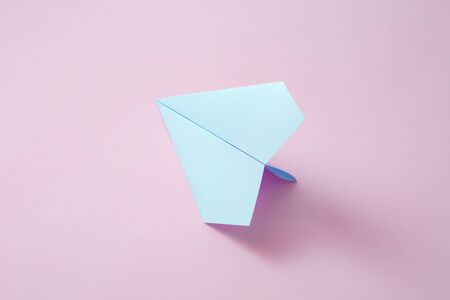 paper airplane on pastel background.の写真素材