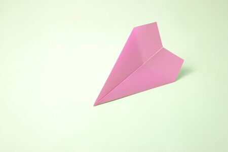 paper airplane on pastel background.の写真素材