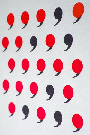 black comma in many red commas.の写真素材