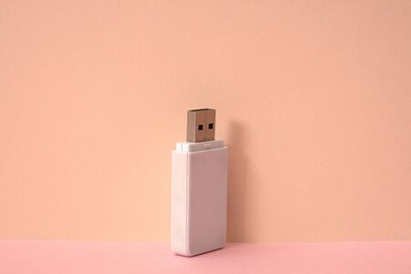 Pink color background and white USB memory storage.の写真素材