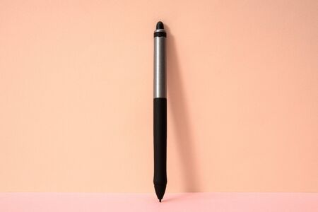 Pink color background and drawing electron pen.の写真素材