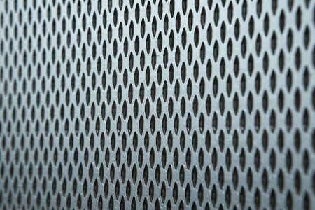The texture and pattern of perforated metal.の写真素材