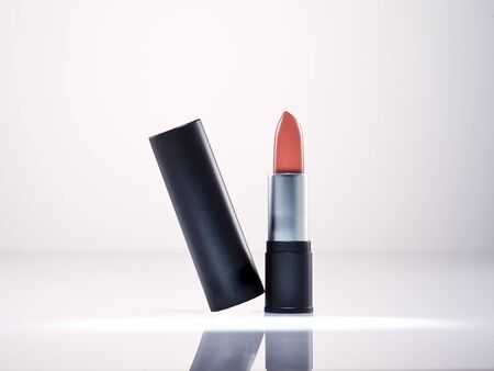 any of various colored lipstick in a case made of black plastic and steel.の写真素材