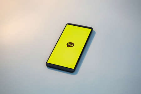 Message app KAKAO TALK logo on smartphone screen.のeditorial素材
