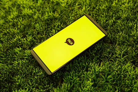 Message app KAKAO TALK logo on smartphone screen.