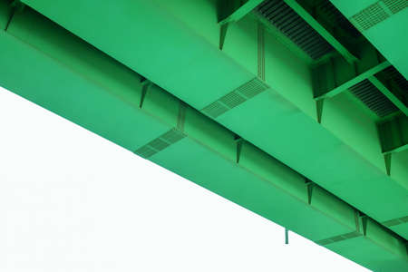 the underside of a road pier painted green.の写真素材