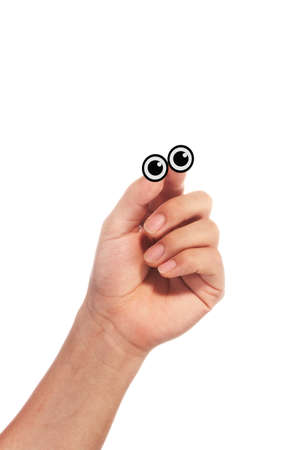 eyeball paper attached to fingers.の写真素材