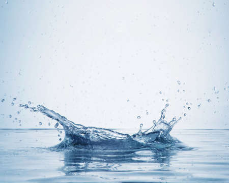 a scene in which drops of water splash after dropping an object in the water.の写真素材