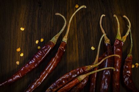 Composition of dried guajillo chili with seeds on wooden tableの写真素材