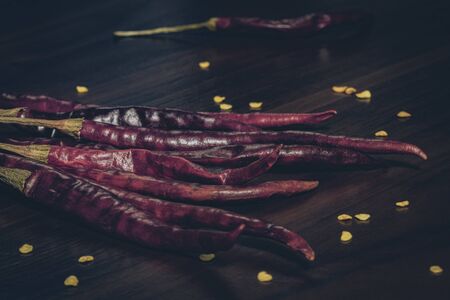 Composition of dried guajillo chili with seeds on wooden tableの写真素材
