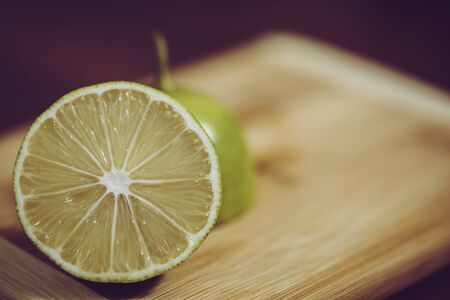 Lime split in half on wooden tableの写真素材