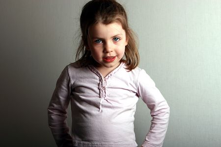 Shot of a young girl posing with hands on hipsの写真素材