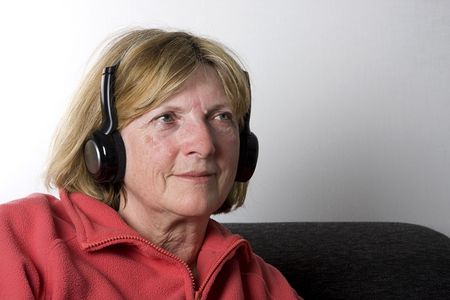 Shot of a Senior Lady with her Wireless Headphonesの写真素材