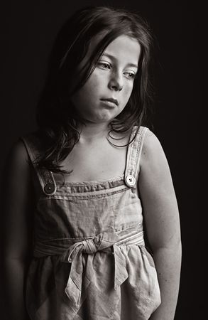 Powerful Low Key Shot of an Upset Young Girlの写真素材