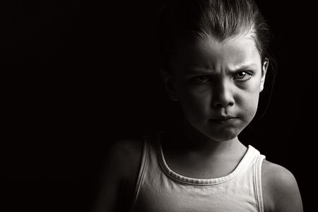 Powerful Low Key Shot of a Child with Attitudeの写真素材