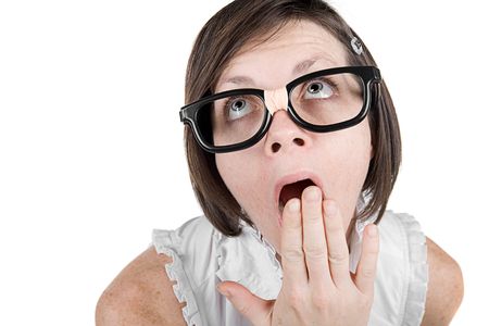 Shot of a Cute Geeky Girl with Hand Over Mouth Yawningの写真素材