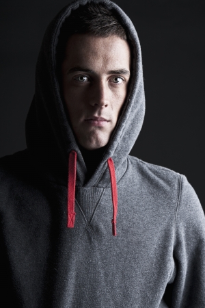 Shot of a Young Male in Hooded Topの写真素材