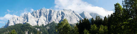 View of Zugspitze Mountains seen from bank of Lake Eibseeの写真素材
