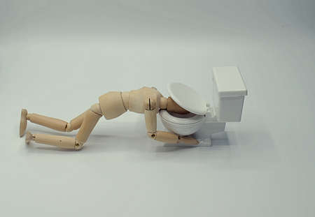 Drawing Mannequin being sick in the toilet, with lid closed on head