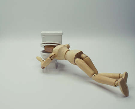 Drawing Mannequin being sick in the toilet, with lid closed on head