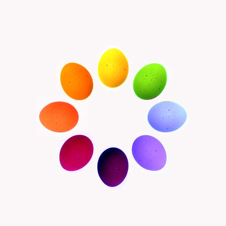 Eight eggs arranged in a circle in bright colorsの写真素材
