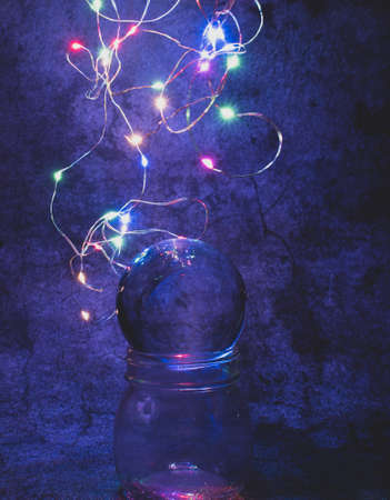 Lens ball on textured background with bold led lights, to mimic outer space.