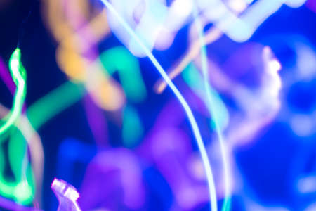 Abstract blurry background created by LED light trails.の写真素材