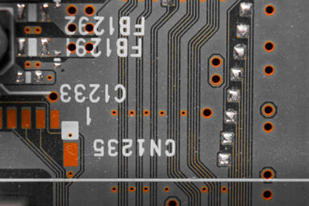 A closeup on part of a DVD player circuit boardの写真素材