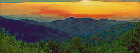 Sunrise over Shenandoah National Park, with mountains in silhouette and the sky a golden orange.の写真素材