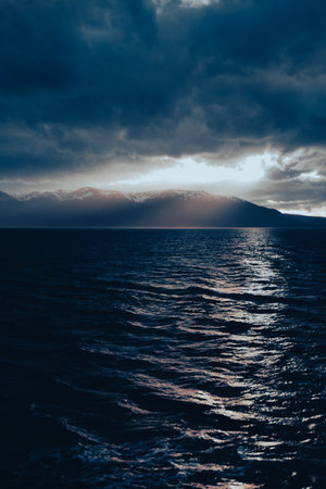 Beautiful seascape with mountains and clouds. Toned.の写真素材