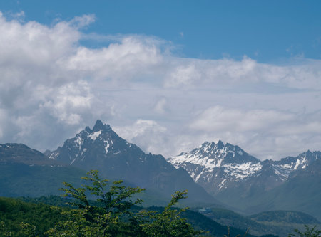 Mountain landscape with snow capped peaks in the clouds. Caucasus, Russiaの写真素材