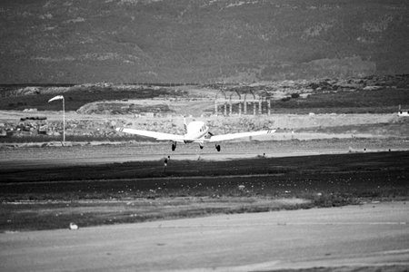 Airplane in the airport runway. Black and white. Travel concept.の写真素材