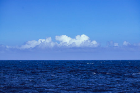 Seascape with blue sky and white clouds in the sea.の写真素材