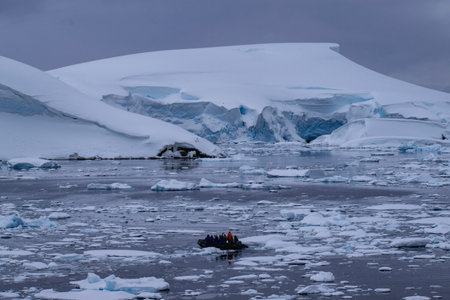 Antarctic landscape with icebergs, ice and people in Antarcticaの写真素材
