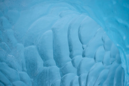 Close up on bubble texture created in iceberg laying on the beach in Antarctica.の写真素材