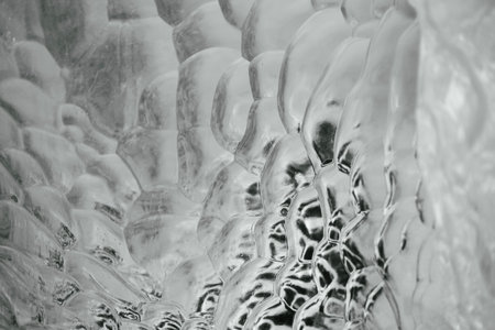 Close up on bubble texture created in iceberg laying on the beach in Antarctica.の写真素材