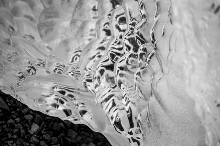 Close up on bubble texture created in iceberg laying on the beach in Antarctica.の写真素材