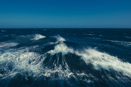 Boat wake waves in the Drake Passage, causing spray to come off the water.の写真素材